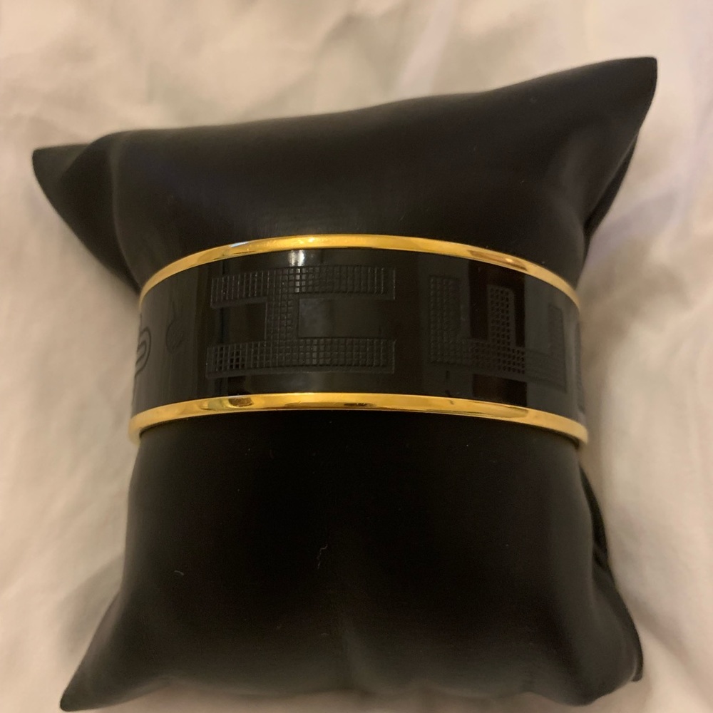Hermès black and gold enamel bangle